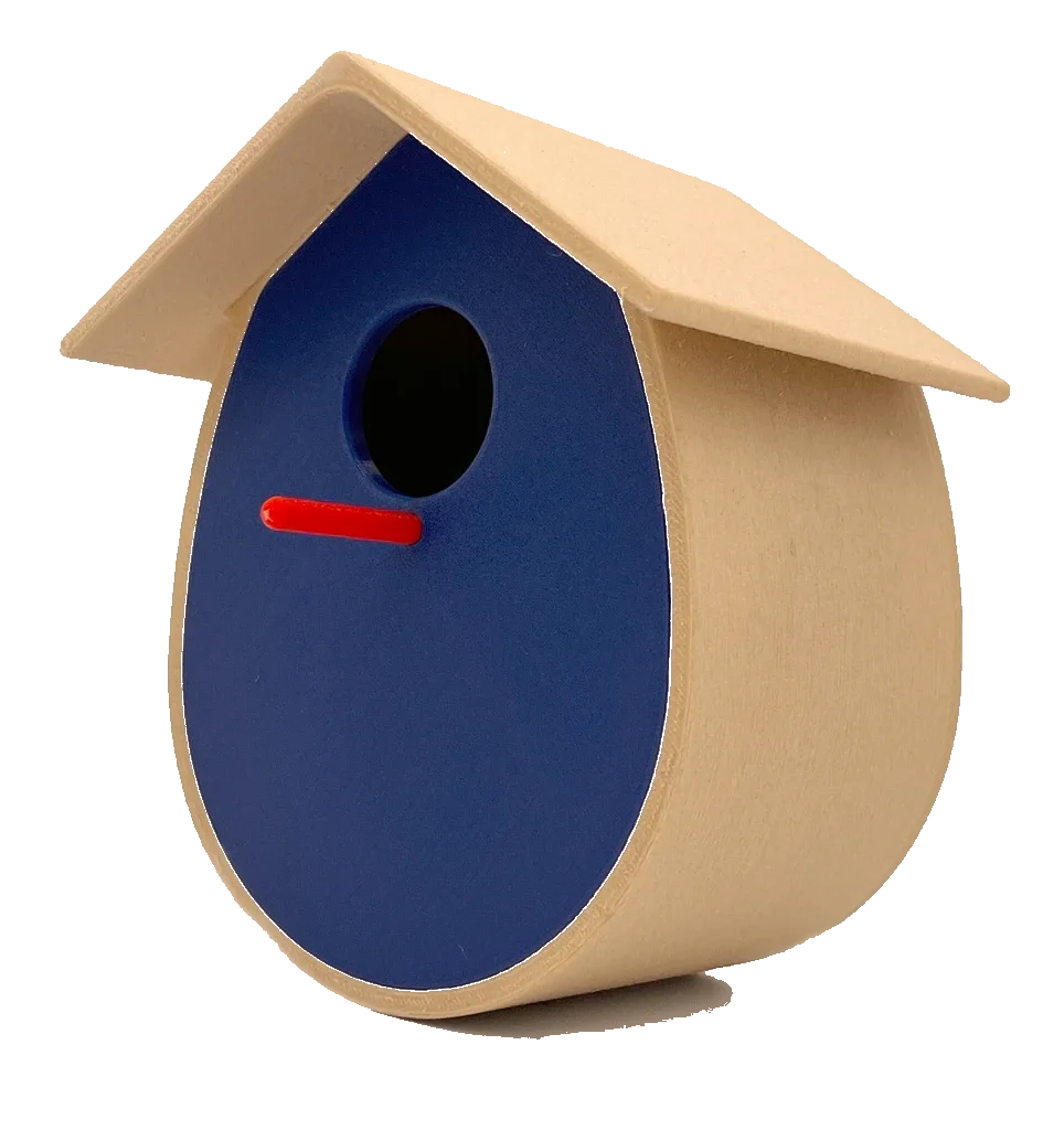 A 3D-printed birdhouse with a matte tan curved body and pitched roof, a deep blue oval face, a round entrance hole and a small red perch